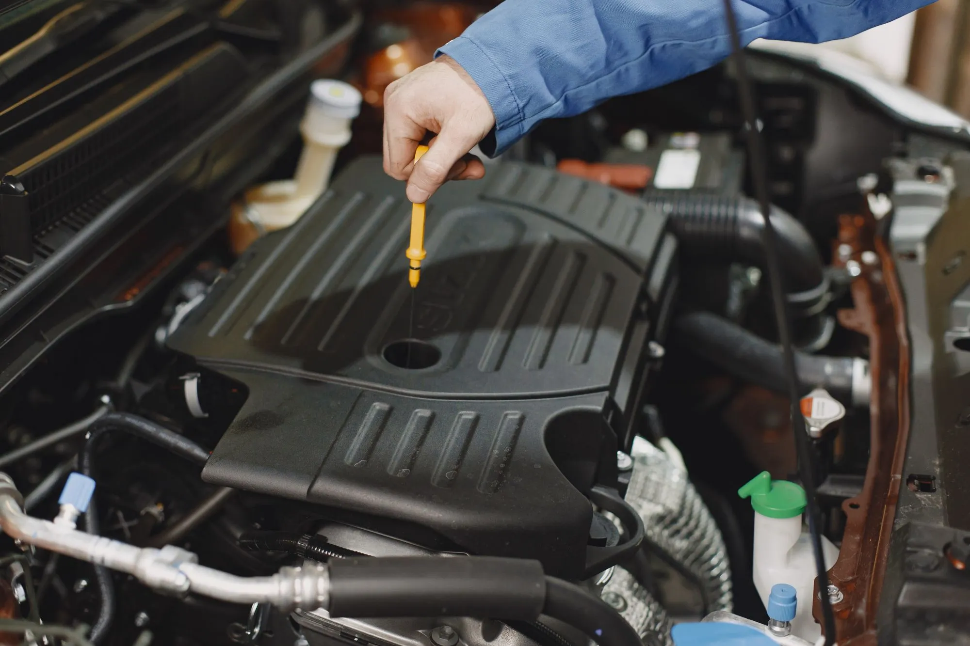 Oil seepage and fluid leak evidence on an engine component during a pre-purchase inspection